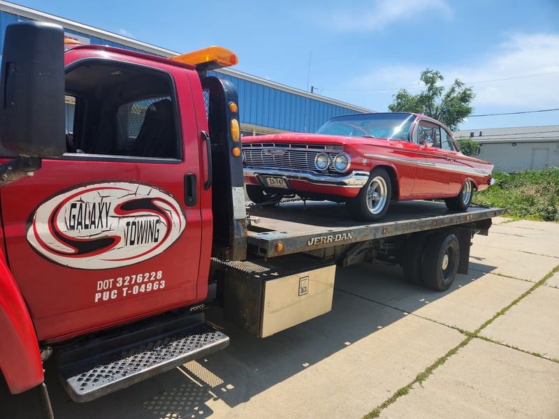 galaxy towing red cadillac